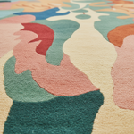 Close-up of a colorful abstract patterned rug with pastel shades.