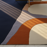 Colorful geometric rug with circular patterns on a marble floor