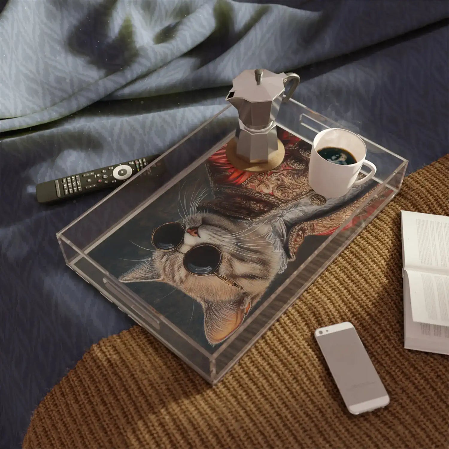 acrylic tray with cat portrait art displayed on dark wicker surface with accessories nearby overhead view