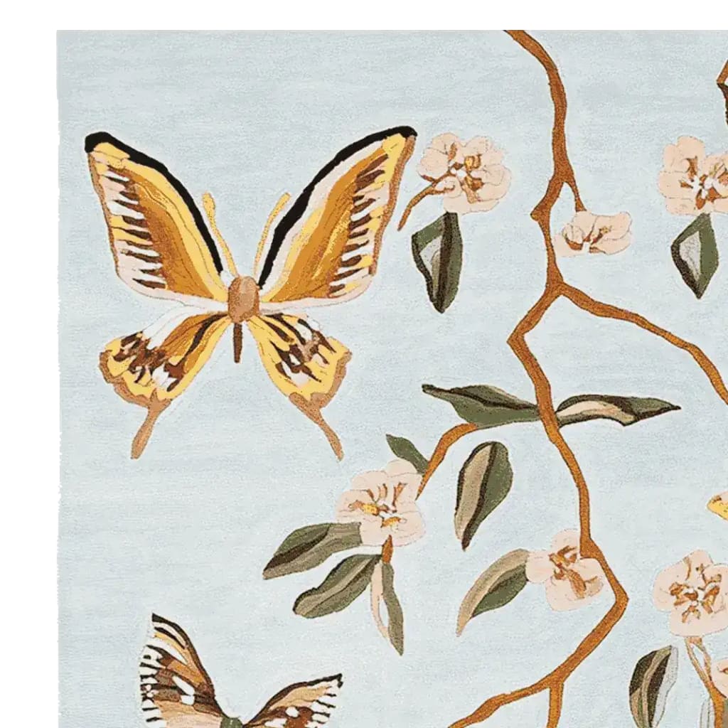 A beautifully designed area rug featuring a hand-tufted wool pattern of vibrant butterflies and delicate flowers. This wool rug is perfect for adding an artistic touch to your living room, making it a stylish choice for those seeking unique living room area rugs.