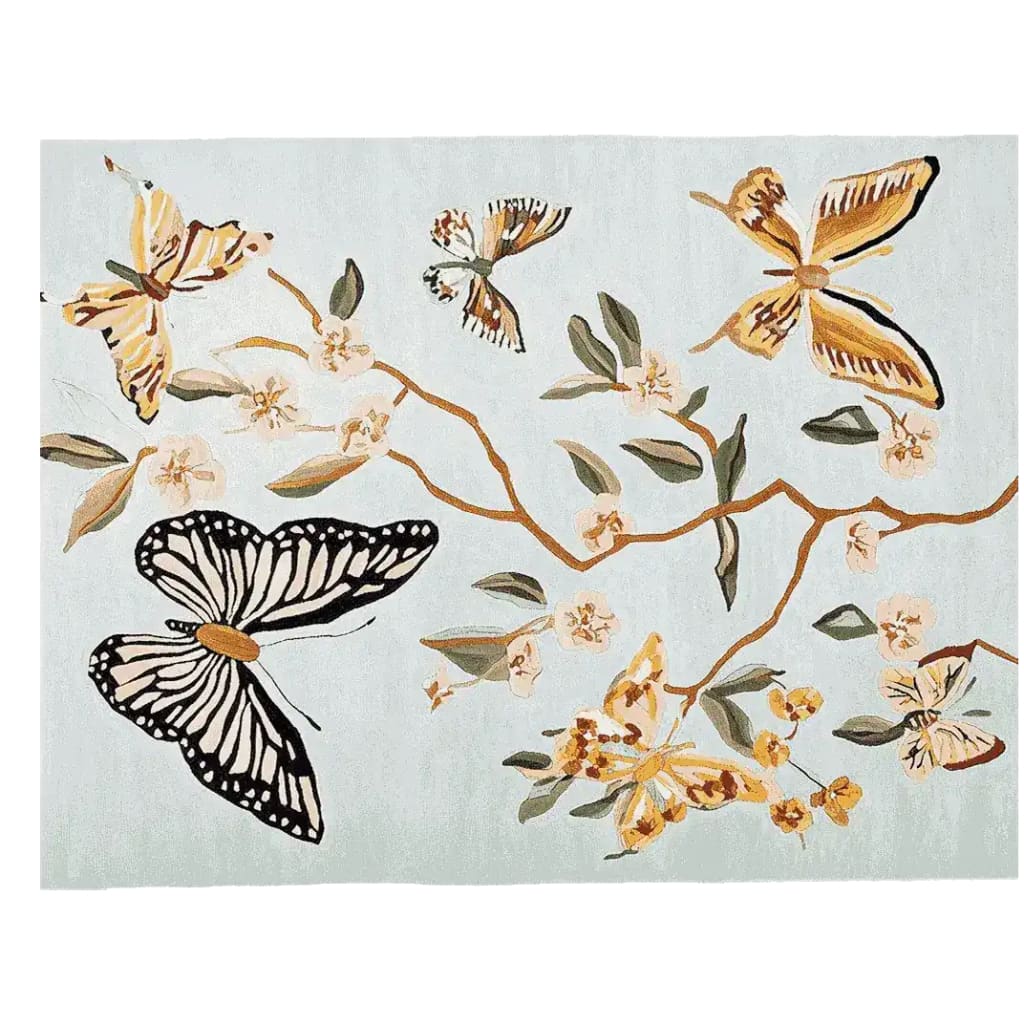 A beautifully hand-tufted area rug featuring a vibrant design of butterflies and floral motifs. This wool rug is perfect for adding a touch of elegance to any living room, making it a stunning choice among living room area rugs.