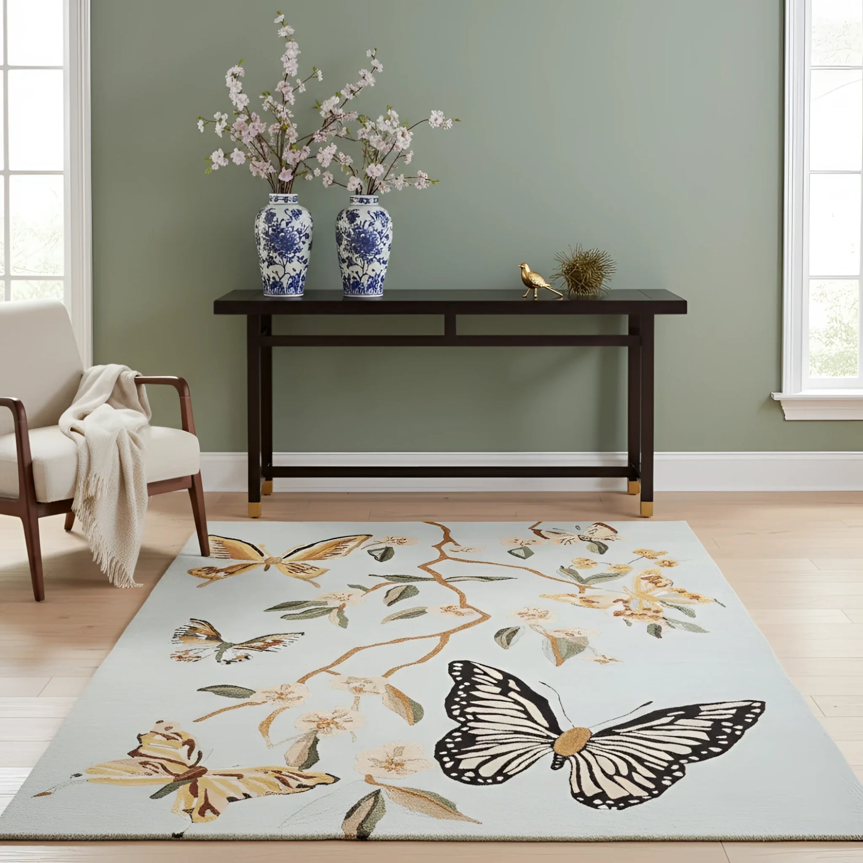Decorative rug with butterfly and floral design in a room with a console table and chairs.