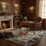 Cozy living room with fireplace, bookshelves, and a desk.