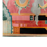 Vibrant and intricately designed area rug featuring a celestial dragon motif in shades of pink, orange, and green. The detailed hand-tufted wool rug showcases a combination of swirling clouds and geometric patterns, adding a touch of luxury and cultural depth to any space.