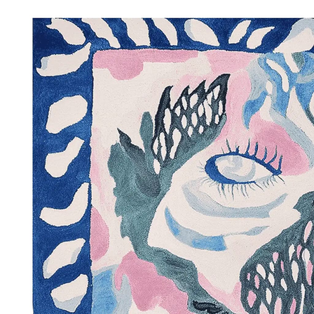 Close-up view of the Celestial Eye Flow Hand Tufted Area Rug, showcasing its abstract design with vibrant blue, pink, and green hues. This contemporary wool rug features a unique eye motif, perfect for adding a touch of artistry to living room spaces. Ideal for those seeking a square area rug or living room rugs 8x10.