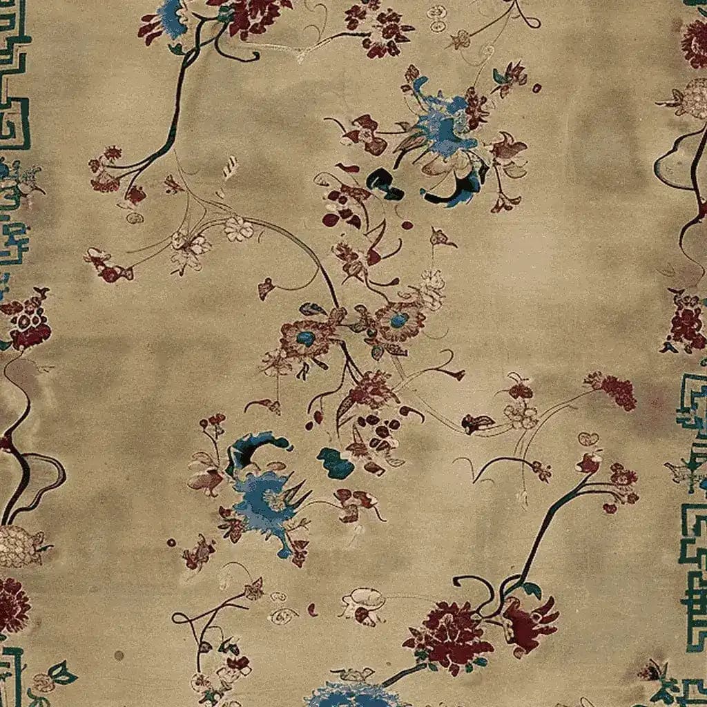 A close-up view of the Celestial Floral Dream Hand Knotted Area Rug, showcasing intricate floral designs in rich blue, burgundy, and cream tones. This wool rug offers a luxurious touch, perfect for adding elegance to any living room decor.