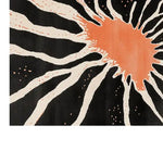 Top view of Celestial Harmony Hand Tufted Wool Area Rug showcasing an abstract design with a bold orange splash and radiating black and white lines.
