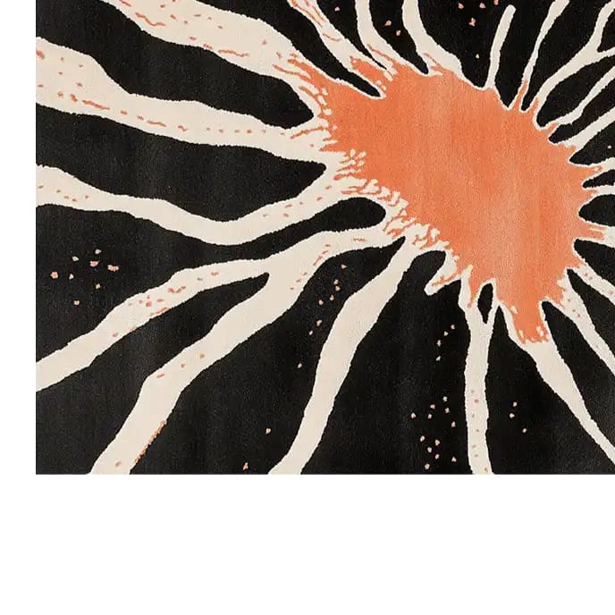 Top view of Celestial Harmony Hand Tufted Wool Area Rug showcasing an abstract design with a bold orange splash and radiating black and white lines.