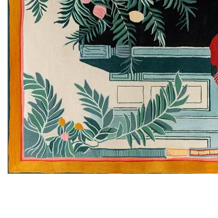 Close-up view of the Celestial Phoenix Retreat hand-tufted wool area rug, showcasing intricate green foliage and geometric patterns with vibrant accents on a soft, light background.