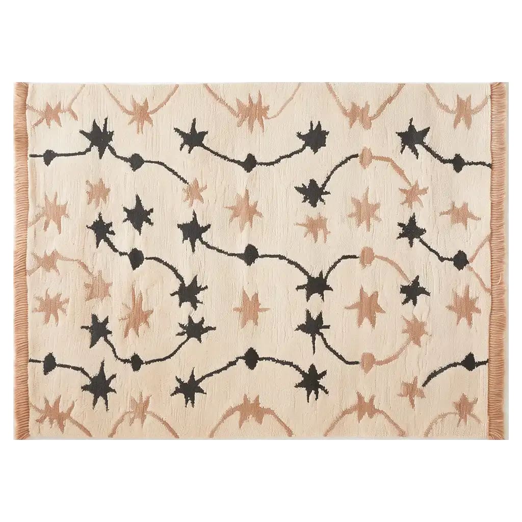 Top view of the Celestial Rhapsody Knotted Wool Area Rug showcasing a unique starry pattern in black and brown on a light background, ideal for adding a celestial touch to any room.
