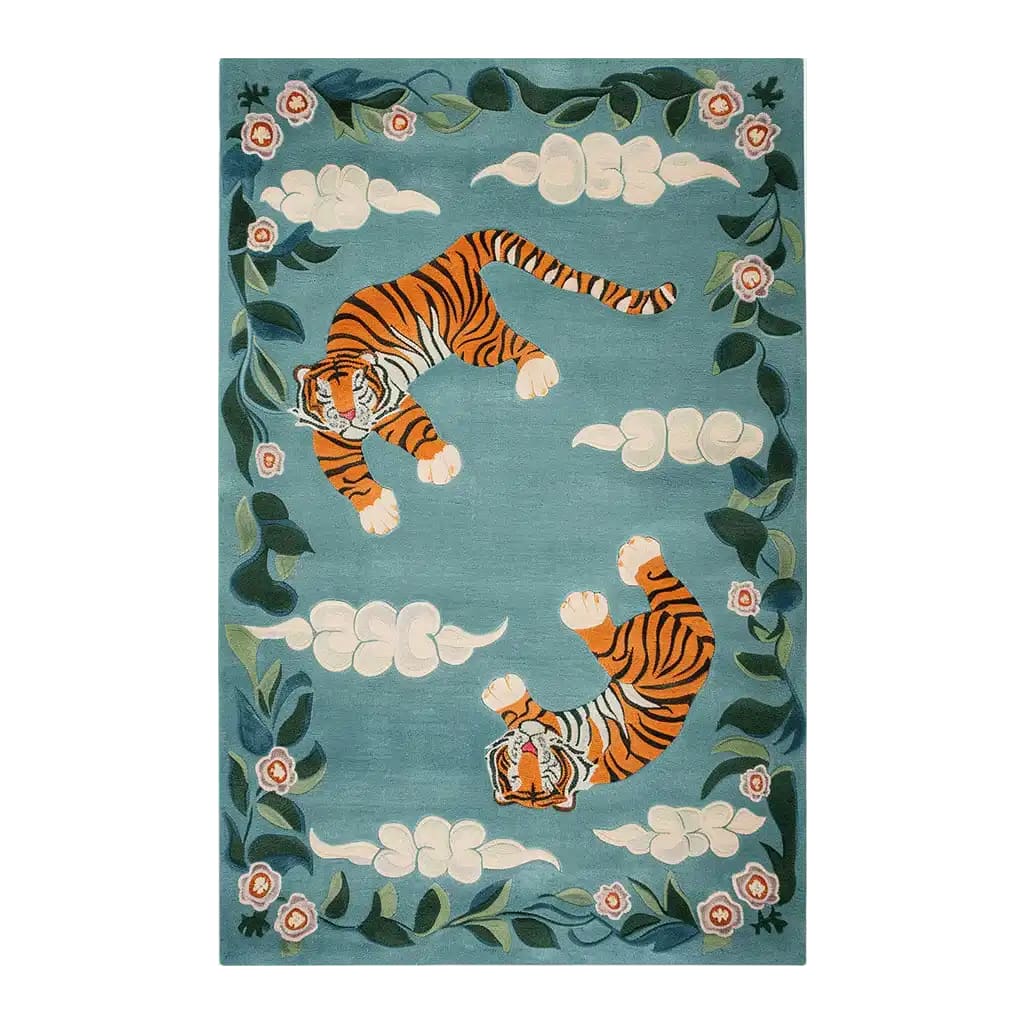 Vibrant area rug featuring an abstract design with two tigers amidst a backdrop of swirling clouds and floral accents on a teal background. The hand-tufted wool rug brings a touch of elegance and wildlife art to any room.