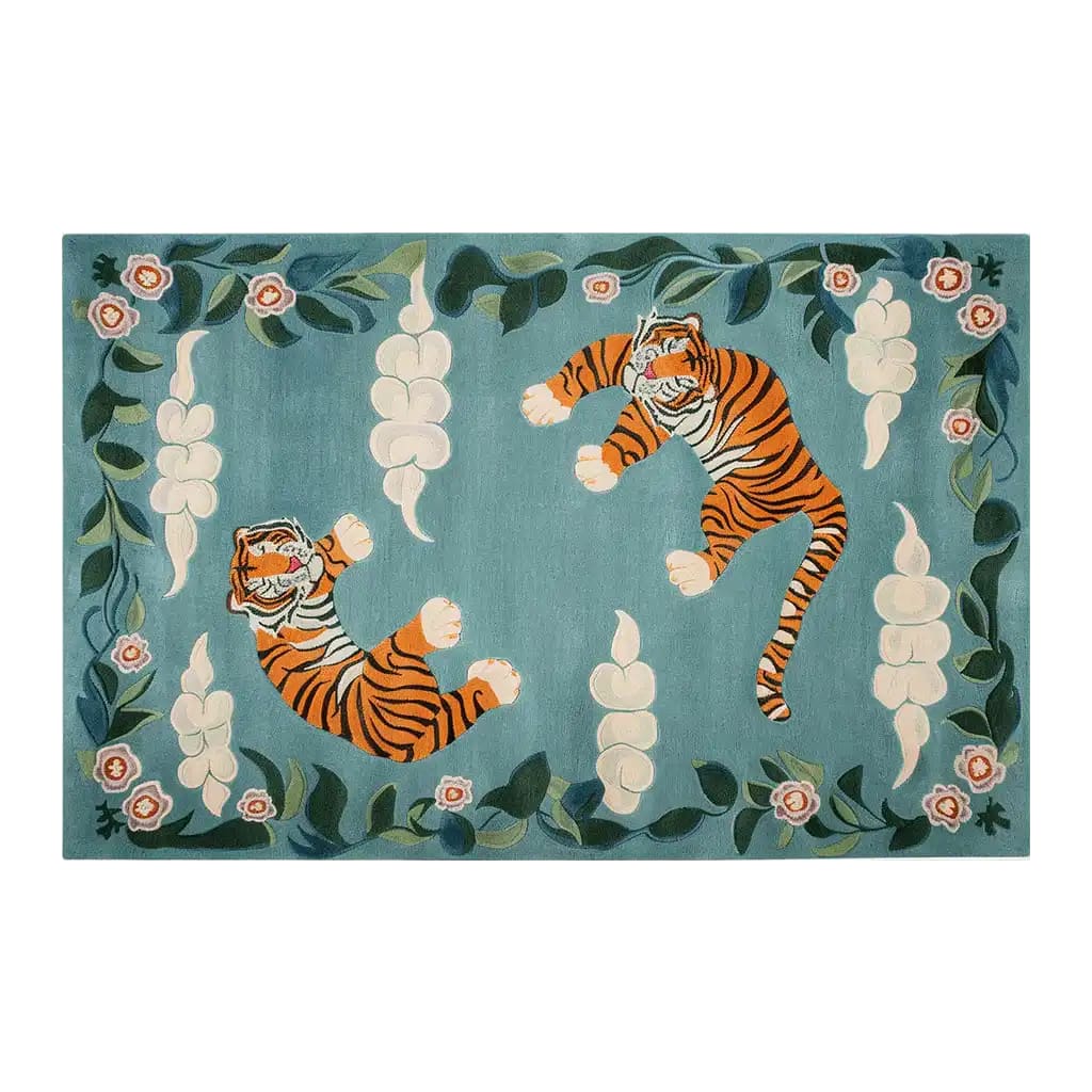 Vibrant area rug featuring playful tigers in an abstract design, surrounded by floral and leaf patterns on a teal background.