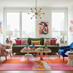 Modern living room with colorful decor, green sofa, pink tiger rug, and abstract art.
