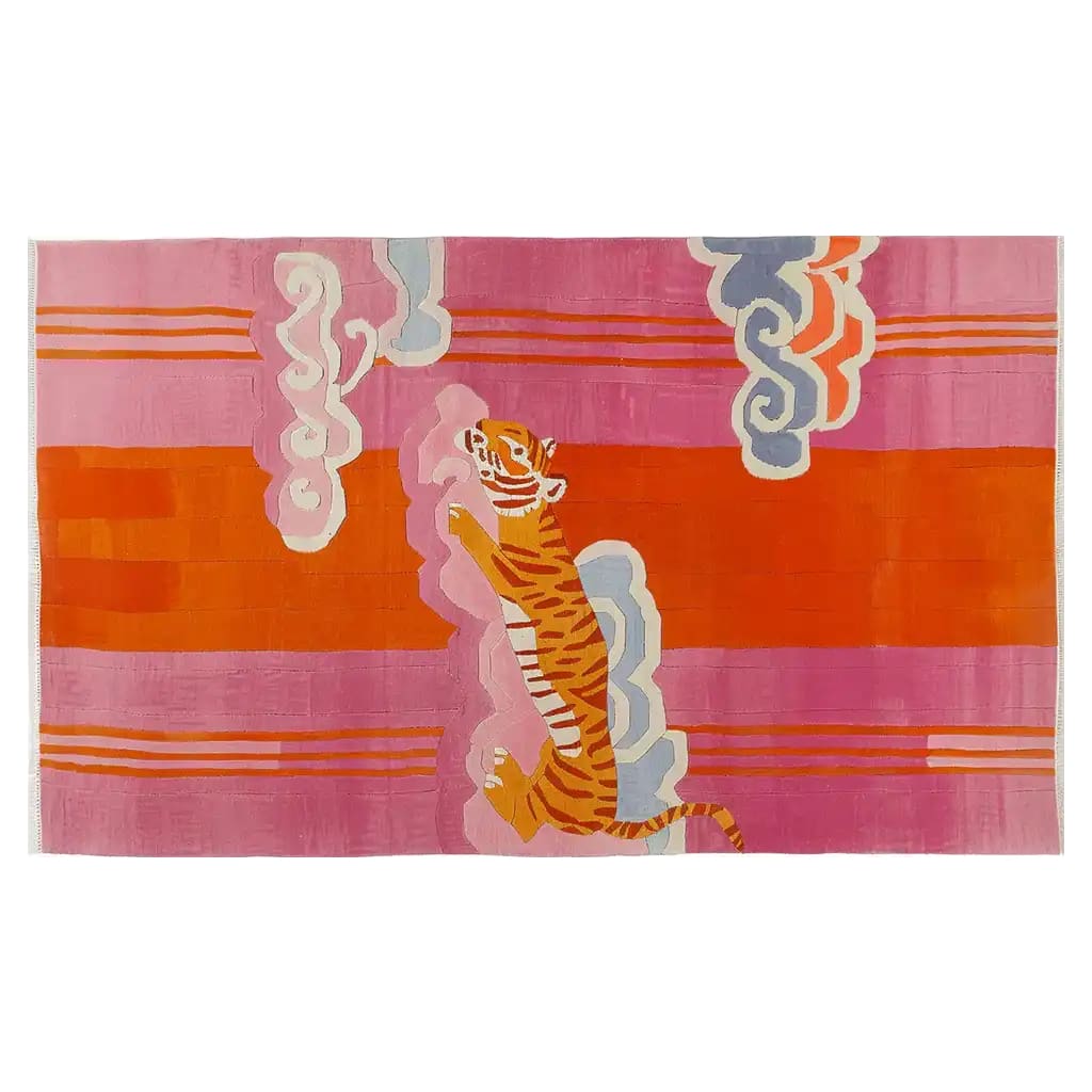 A vibrant area rug featuring an abstract celestial tiger design in bold pink, orange, and blue hues, showcasing a unique and artistic representation of a tiger amidst swirling clouds.