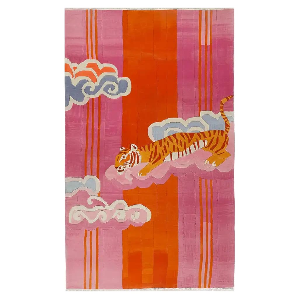 Bright and colorful area rug featuring a hand-tufted wool design with a celestial tiger motif. The rug showcases vibrant hues of orange, pink, and blue, with a playful abstract tiger walking among stylized clouds, perfect for adding a bold statement to any room.