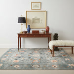 A beautifully designed area rug featuring a celestial tranquility theme with intricate floral patterns in soft pastel colors. The wool rug showcases a harmonious blend of blues and pinks, creating a serene and elegant look.