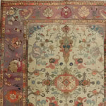 This Charming Blooms Hand Knotted Area Rug showcases an intricate vintage design with a floral pattern, perfect for adding a touch of elegance to your living room. Ideal for those seeking a unique Persian rug, this 8x10 rug blends timeless beauty with a modern aesthetic, making it an excellent choice for living room rugs.