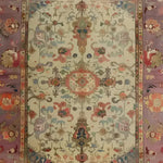 Charming Blooms Hand Knotted Area Rug featuring intricate vintage Persian designs with rich floral patterns. This elegant 8x10 living room rug showcases a harmonious blend of earthy tones, perfect for adding a touch of sophistication to any space.