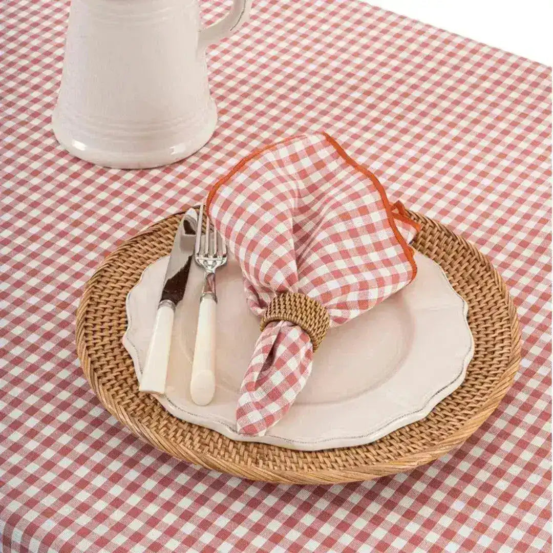 Checkered Charm Placemats in table setting with dinnerware and glasses, styled overhead view