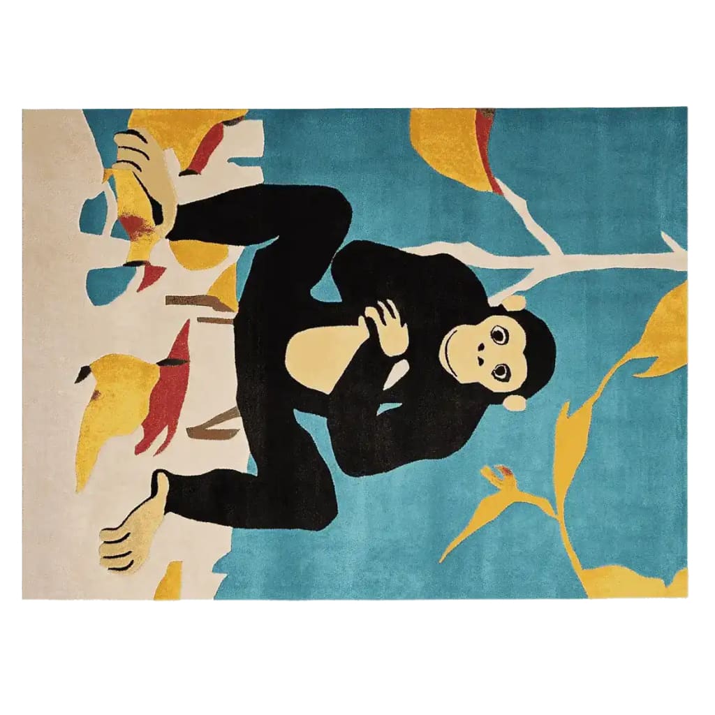 A vibrant area rug featuring a playful chimp design, hand-tufted with wool. This contemporary rug showcases bold colors with the chimp set against a sky-blue background adorned with abstract leaves, ideal for adding a whimsical touch to large living room spaces.