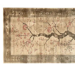 A beautifully detailed area rug featuring an elegant cherry blossom design. The branches and pink blossoms are gracefully spread across a beige background, framed by intricate geometric patterns along the border.