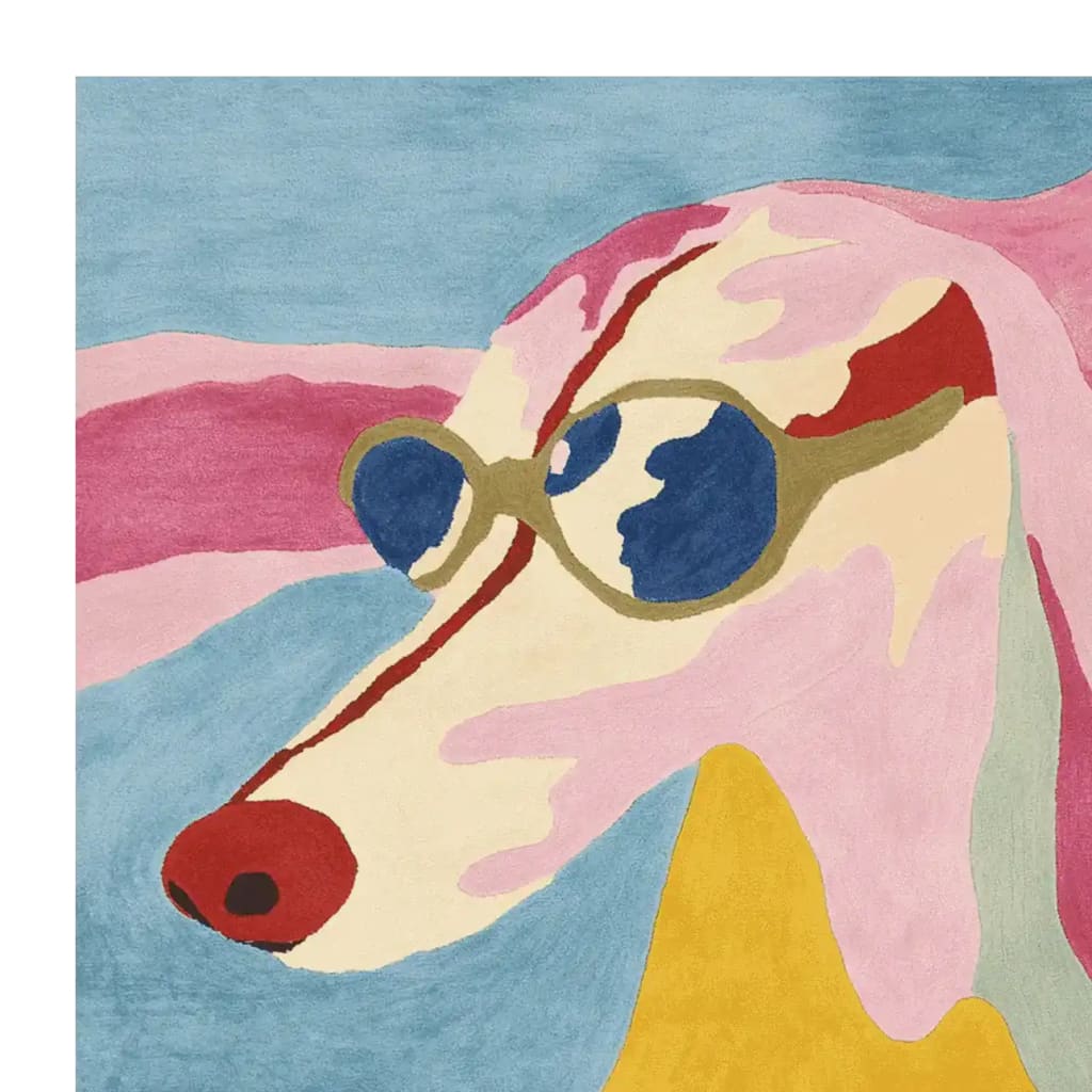 A vibrant hand-tufted area rug featuring an abstract dog design with sunglasses, blending bold colors like red, blue, pink, and yellow. This contemporary rug adds a playful touch to large living room spaces, perfect as a wool rug centerpiece.