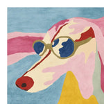 A vibrant hand-tufted area rug featuring an abstract dog design with sunglasses, blending bold colors like red, blue, pink, and yellow. This contemporary rug adds a playful touch to large living room spaces, perfect as a wool rug centerpiece.