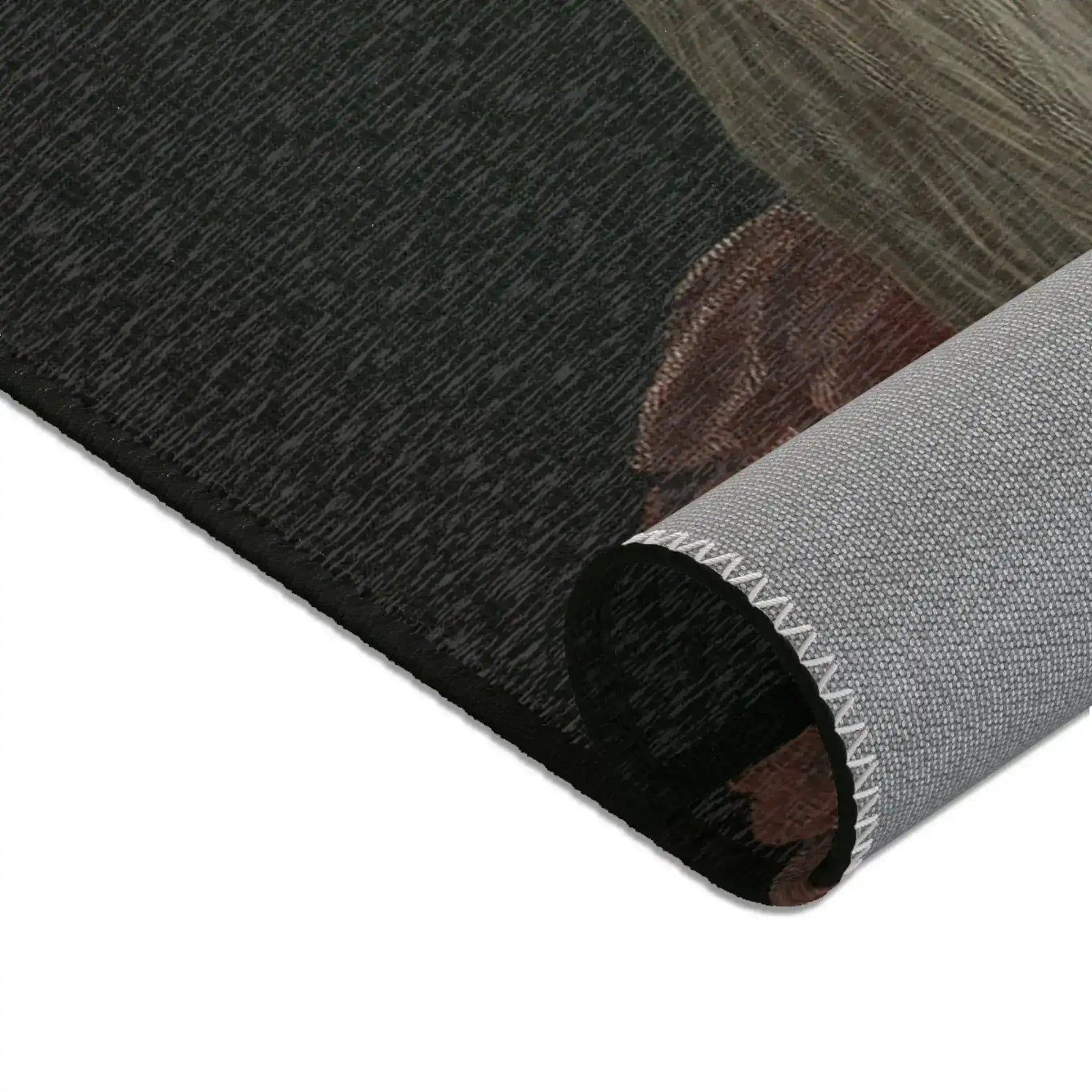 Rolled corner closeup of dark charcoal accent rug with brown rounded edge and grey anti-slip backing, Chic Renaissance Chicken Accent Rug