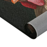 Corner fold of dark charcoal print with red rooster comb top detail and grey woven backing edge, Chic Renaissance Chicken Accent Rug