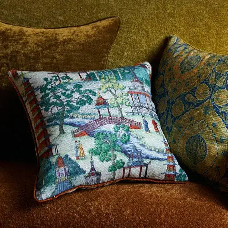 Chinoiserie courtyard throw pillow cover featuring a colorful design with pagodas, trees, and a bridge, perfect for adding a decorative touch to any living space.