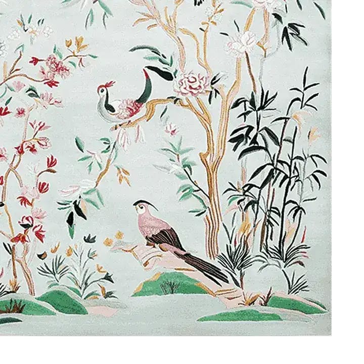 Close-up view of a Chinoiserie Garden Bliss Hand Tufted Area Rug, ideal for living rooms. The wool rug features intricate designs of birds and floral patterns, perfect for adding elegance to any living room space. This 8x10 living room rug showcases vibrant colors and exquisite detail.