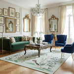 Luxurious living room with a green chinoiserie chic rug, green sofa, blue chairs, and decorative elements