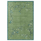 Green floral patterned rug on a white background