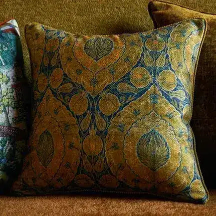 Chinoiserie-style throw pillow cover featuring an intricate floral pattern in rich gold and blue tones, perfect for adding a touch of elegance to any courtyard or living space.