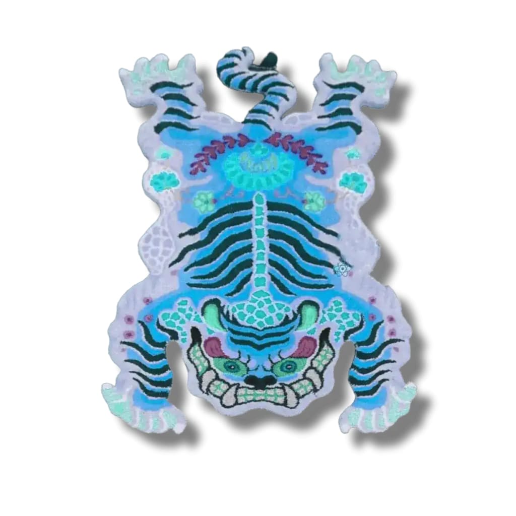 A vibrant Chinoiserie Tibetan Tiger hand-tufted wool area rug in blue, perfect for adding an artistic touch to your office or formal dining room. The rug features an abstract tiger design, making it an eye-catching dining table rug for any dining room.