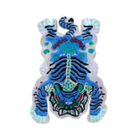 Top view of a Chinoiserie Tibetan Tiger hand-tufted wool area rug in blue, featuring a vibrant abstract tiger design. Perfect for adding a bold statement to an office or formal dining room, this unique dining table rug combines traditional artistry with contemporary flair.