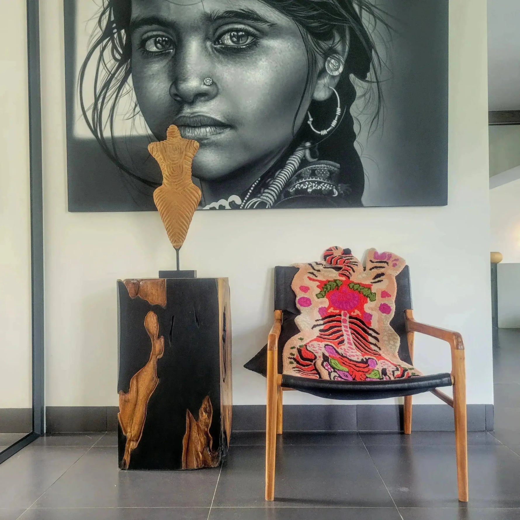 A stylish living room setting featuring a Chinoiserie Tibetan Tiger hand-tufted wool rug in pink. The area rug, with its vibrant abstract tiger design, adds a bold touch to the modern decor. Ideal for living room and dining room spaces, this wool rug enhances the warmth and aesthetic of large living areas.