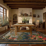 Chinoiserie Vista Hand Tufted Area Rug in a rustic living room setting, showcasing a vibrant floral design with rich colors, under a wooden dining table. Perfect for adding elegance to large living room spaces, this wool rug complements the warm, earthy tones of the room, creating a cozy and inviting atmosphere.