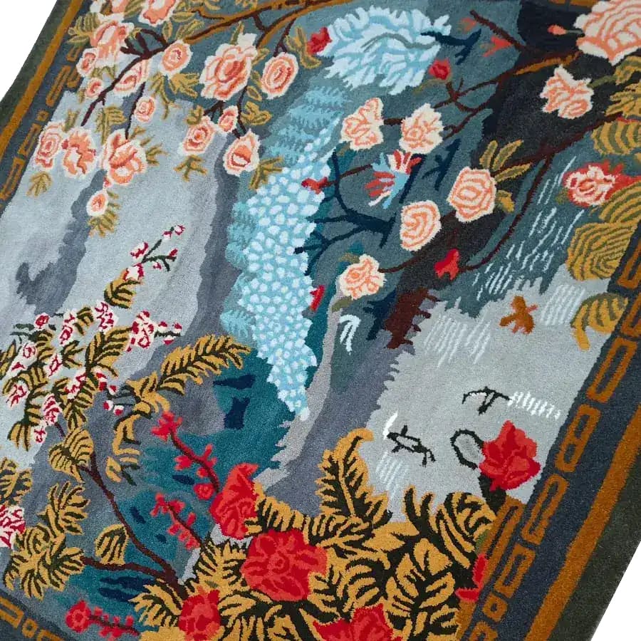 Elegant Chinoiserie Vista Hand Tufted Area Rug featuring a vibrant floral design with rich colors like blue, red, and peach. This large area rug, perfect for a living room, showcases intricate wool patterns and a square shape, adding a touch of sophistication and warmth to any space.