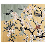 A beautifully designed area rug featuring an intricate pattern of birds and cherry blossoms on a soft, muted background. Ideal for large living room spaces, this wool rug adds an elegant touch with its hand-tufted texture and artistic flair.
