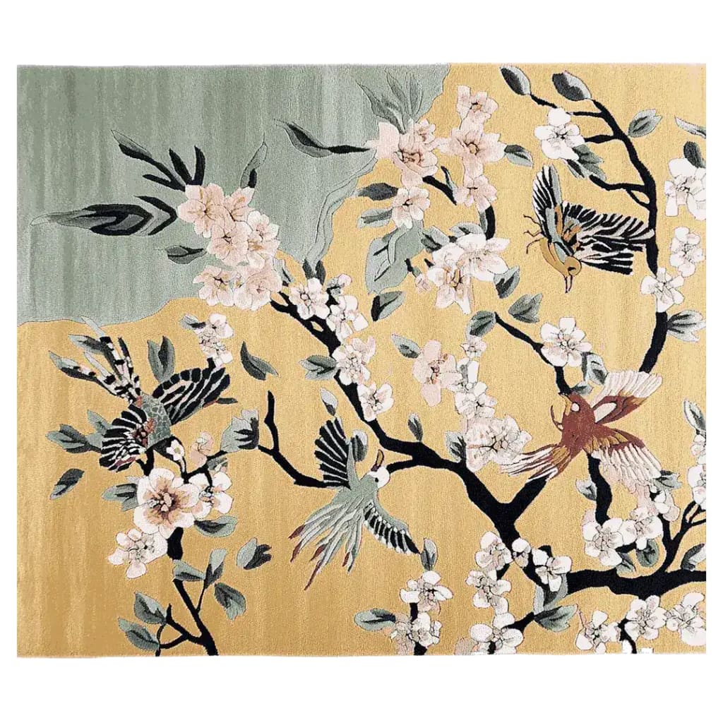 A beautifully designed area rug featuring an intricate pattern of birds and cherry blossoms on a soft, muted background. Ideal for large living room spaces, this wool rug adds an elegant touch with its hand-tufted texture and artistic flair.