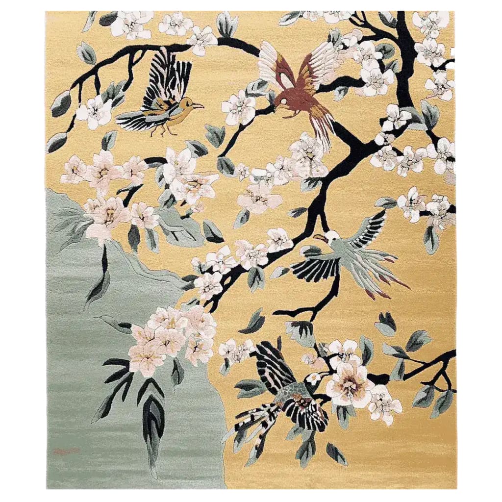 Hand-tufted area rug featuring a vibrant design of birds and cherry blossoms on a rich golden background, ideal for large living room spaces. Crafted from high-quality wool, this rug adds an elegant touch to any decor.