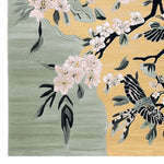 Chirping Petal Dance Hand Tufted Area Rug showcasing an elegant floral design in soft pastel colors. Perfect for large living rooms, this wool rug adds a touch of nature-inspired charm with its intricate flower patterns and gentle tones.