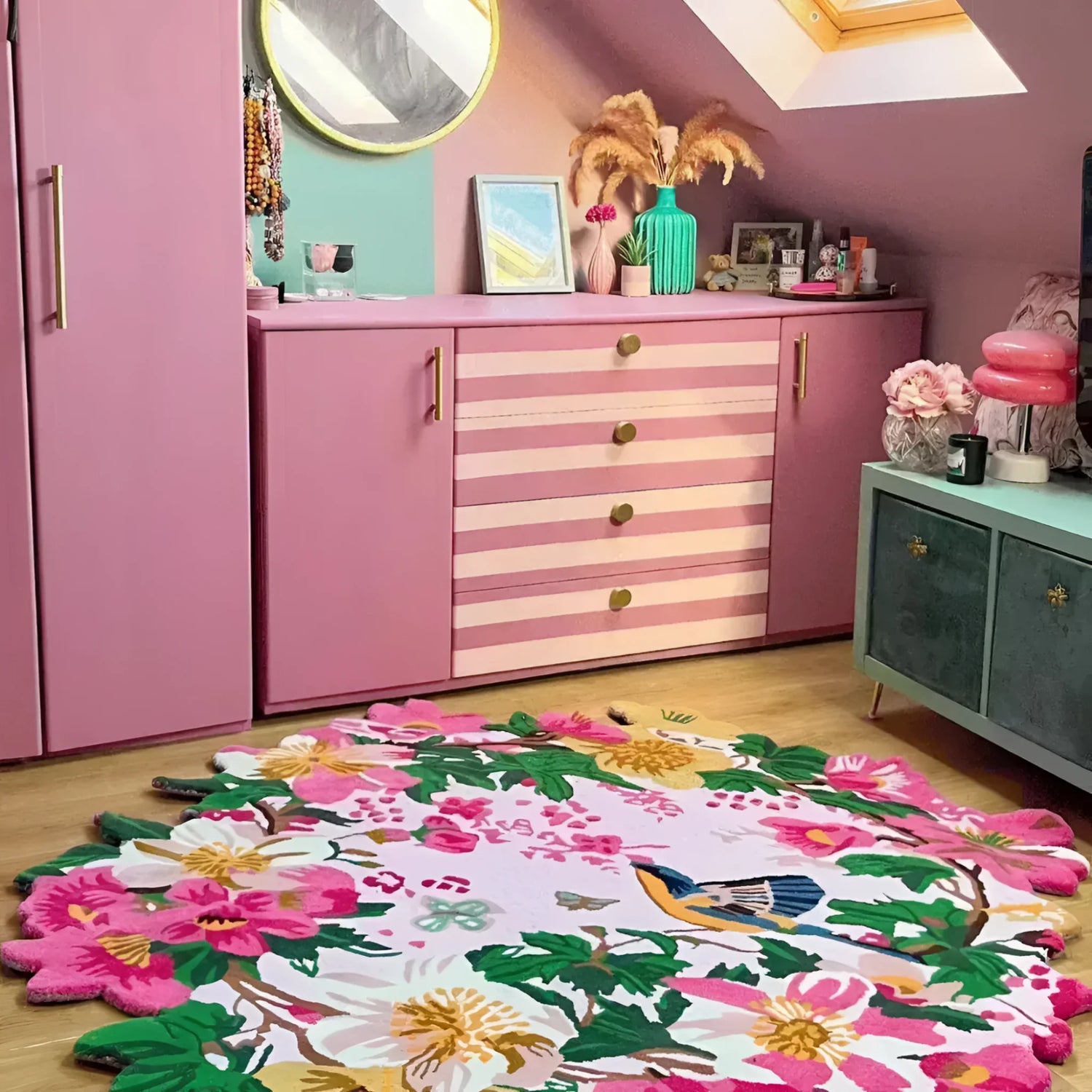 Embrace the vibrant dance of nature with the Chromatic Bloom Hand Tufted Round Rug. Lush, hand-tufted wool brings a kaleidoscope of colorful flowers to life against a soft, peach pastel base. A graceful bird soars overhead, its silhouette adding a touch of whimsy to this captivating scene. This luxurious circular rug injects a burst of energy and joy into any room.