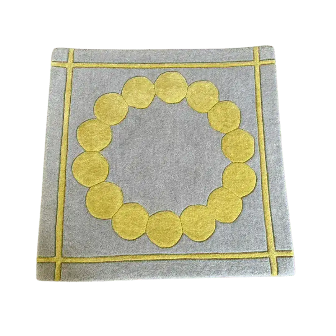 A stylish gray area rug featuring a contemporary design with a circle of yellow suns in the center, perfect for a modern bedroom. This square hand-tufted wool rug brings a touch of elegance and warmth as a bedroom area rug.