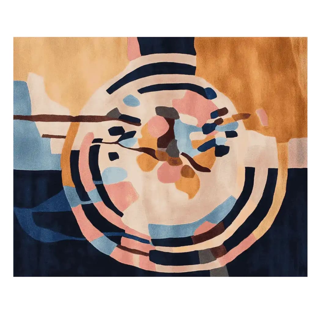 A contemporary hand-tufted area rug featuring an abstract circular design with vibrant colors like blue, pink, and gold. Perfect for large living rooms, this wool rug adds a modern touch to any space.