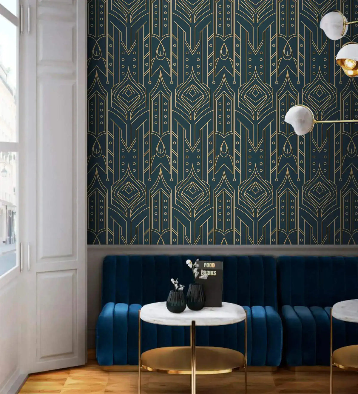 Cityscape glam wallpaper with gold Art Deco pattern on deep navy behind a curved navy velvet banquette and marble tables