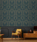 Cityscape glam wallpaper with gold geometric Art Deco pattern on navy above dark wainscoting and a mustard retro chair