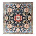 A beautifully crafted Classic Botanical Design Hand Tufted Area Rug, perfect for adding elegance to your living room. The rug features intricate floral patterns in vibrant shades, showcasing the sophistication of wool rugs, making it an ideal choice for living room area rugs.