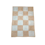 Top view of a Classic Checker Jute Rug in natural color, featuring a checkered pattern perfect for large area rugs. Ideal for adding a touch of elegance to your living room, this 8x10 area rug blends seamlessly with various decor styles. Perfect for those seeking durable jute rugs for their living space.
